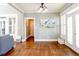 Bright living room with hardwood floors, French doors, and ample natural light at 109 Lighthorse Blvd, Mcdonough, GA 30252