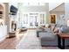 Cozy living room featuring a fireplace, built-in shelving, and access to the outdoors at 109 Lighthorse Blvd, Mcdonough, GA 30252