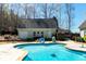 In-ground swimming pool with a concrete deck and a view of the detached garage at 109 Lighthorse Blvd, Mcdonough, GA 30252