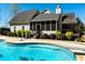 Back exterior view of the home featuring a large in-ground swimming pool and deck at 109 Lighthorse Blvd, Mcdonough, GA 30252