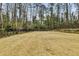 Large backyard with well maintained lawn and wood fence at 258 Pineland Nw Rd, Atlanta, GA 30342