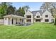 Expansive backyard featuring a pool, pool house and a modern home at 258 Pineland Nw Rd, Atlanta, GA 30342