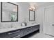 Bathroom featuring a double vanity, marble countertop, and a view of the shower at 258 Pineland Nw Rd, Atlanta, GA 30342