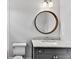 Bathroom featuring granite countertops, under sink cabinets, decorative mirror and a toilet at 258 Pineland Nw Rd, Atlanta, GA 30342
