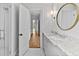 Bright bathroom showcasing marble counters, white cabinets, decorative lighting and a glass shower at 258 Pineland Nw Rd, Atlanta, GA 30342