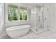 Bathroom featuring a soaking tub, walk-in shower, and mosaic tile floor at 258 Pineland Nw Rd, Atlanta, GA 30342