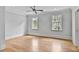 Spacious bedroom with hardwood flooring, large windows, crown molding, and recessed lighting at 258 Pineland Nw Rd, Atlanta, GA 30342