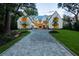 Stunning two-story home with a circular driveway, lush green lawn, and beautifully landscaped yard at 258 Pineland Nw Rd, Atlanta, GA 30342