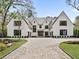 Stunning modern home with a brick driveway, manicured lawn, and professionally landscaped garden at 258 Pineland Nw Rd, Atlanta, GA 30342
