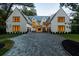 Stunning home with brick driveway and manicured front lawn at 258 Pineland Nw Rd, Atlanta, GA 30342