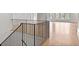 Bright foyer showcasing hardwood floors and black iron staircase at 258 Pineland Nw Rd, Atlanta, GA 30342