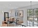 Second story landing showcasing unique light fixture, desk space, and views from the large windows at 258 Pineland Nw Rd, Atlanta, GA 30342