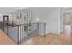 Elegant hallway with hardwood floors, iron railings, and access to various rooms at 258 Pineland Nw Rd, Atlanta, GA 30342