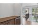 Hallway bar area, features wood cabinetry, and black framed windows and staircase at 258 Pineland Nw Rd, Atlanta, GA 30342