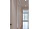 Hallway with wood floor and view of bright window in the next room at 258 Pineland Nw Rd, Atlanta, GA 30342