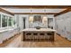 Modern kitchen featuring an island with a marble countertop, bar stools, and stainless steel appliances at 258 Pineland Nw Rd, Atlanta, GA 30342