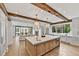 Spacious kitchen features a large island, stainless steel appliances, wooden beams, and an open floor plan at 258 Pineland Nw Rd, Atlanta, GA 30342
