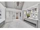 Bright main bathroom with double vanity, marble floors, a glass shower, and modern fixtures at 258 Pineland Nw Rd, Atlanta, GA 30342