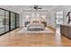 Spacious main bedroom with tray ceiling, hardwood floors, fireplace and serene decor at 258 Pineland Nw Rd, Atlanta, GA 30342