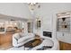 Comfortable main bedroom with a fireplace, built-in shelving, and plenty of seating space at 258 Pineland Nw Rd, Atlanta, GA 30342