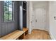 Mudroom features built-in bench, storage cubbies, window and hardwood floors at 258 Pineland Nw Rd, Atlanta, GA 30342