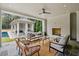 Covered outdoor living space with fireplace, seating, and view of pool at 258 Pineland Nw Rd, Atlanta, GA 30342