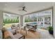 Relaxing covered outdoor living space with a view of the pool and the kitchen area at 258 Pineland Nw Rd, Atlanta, GA 30342