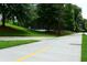 Sidewalk leading to tennis courts in green park area at 258 Pineland Nw Rd, Atlanta, GA 30342