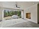 Covered outdoor porch with fireplace, slate floors, and view of pool and backyard at 258 Pineland Nw Rd, Atlanta, GA 30342