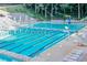 Community swimming pool with lounge chairs and clear blue water at 258 Pineland Nw Rd, Atlanta, GA 30342