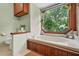 Bathroom with soaking tub, wood accents, and a scenic view of the surrounding trees at 2666 Peachtree Walk, Duluth, GA 30096