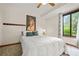 Bedroom with neutral décor, large art piece, and large window with a view to the outside at 2666 Peachtree Walk, Duluth, GA 30096