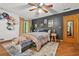 Comfortable bedroom featuring dark accent wall, unique decor, and natural lighting at 2666 Peachtree Walk, Duluth, GA 30096