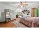 Bright bedroom with hardwood floors, cozy rug, and sunny window nook at 2666 Peachtree Walk, Duluth, GA 30096