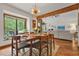 Formal dining room with hardwood floors, chandelier, and view of the living room at 2666 Peachtree Walk, Duluth, GA 30096