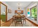 Dining room with hardwood floors, lots of light, and modern chandelier at 2666 Peachtree Walk, Duluth, GA 30096