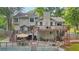 Back of the house with multiple decks, staircase, patio, and a view of the pool at 2666 Peachtree Walk, Duluth, GA 30096