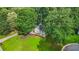 Charming home exterior with a spacious lawn and mature trees, offering great curb appeal at 2666 Peachtree Walk, Duluth, GA 30096