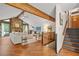Inviting living room with vaulted ceiling, wood beams, stone fireplace, and hardwood floors at 2666 Peachtree Walk, Duluth, GA 30096