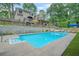 Inviting backyard pool with patio seating and manicured landscaping at 2666 Peachtree Walk, Duluth, GA 30096