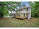 Large backyard featuring a two-story home with deck and ample room for activities at 2201 Logan Dr, Jonesboro, GA 30236
