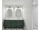 Modern bathroom with double vanity, marble countertops, striking black and white tile and tiled shower at 2201 Logan Dr, Jonesboro, GA 30236