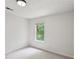 Cozy bedroom with white walls, neutral carpeting, and a window providing natural light at 2201 Logan Dr, Jonesboro, GA 30236