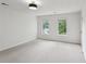 Bright bedroom with carpeted floors, neutral paint, and ample natural light at 2201 Logan Dr, Jonesboro, GA 30236