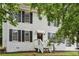 Charming two-story home with white painted brick, black shutters and awning over the front door at 2201 Logan Dr, Jonesboro, GA 30236