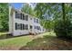 Beautiful two-story house with brick exterior, black shutters, and lush green lawn at 2201 Logan Dr, Jonesboro, GA 30236