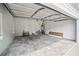 Spacious garage with ample storage and a roll-up door at 2201 Logan Dr, Jonesboro, GA 30236