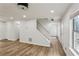 Hallway with hardwood floors and white trim with stairway to the second floor at 2201 Logan Dr, Jonesboro, GA 30236