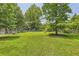 Big backyard with mature trees at 62 Sweetwater Pkwy, Powder Springs, GA 30127