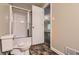 Bathroom featuring a standard white toilet and tub/shower combo with sliding doors at 62 Sweetwater Pkwy, Powder Springs, GA 30127